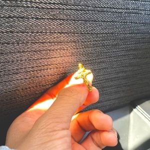 A gold Jesus Christ on the cross ring